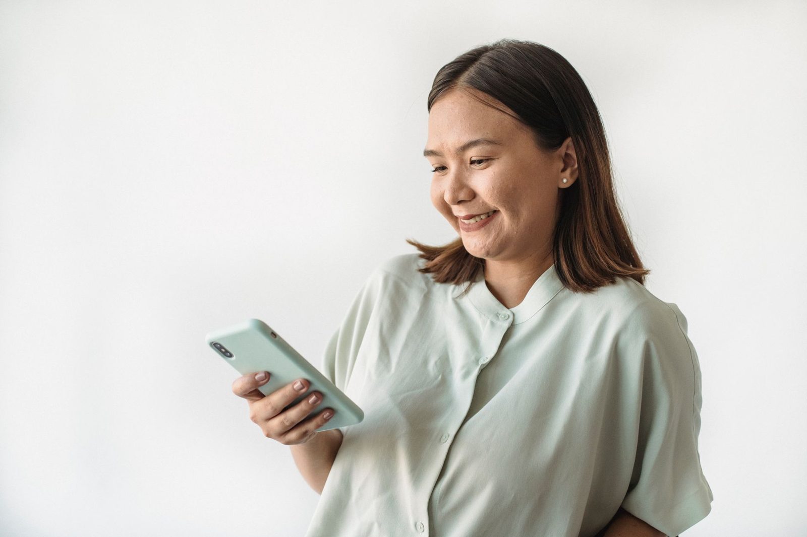 Woman smiling at her phone