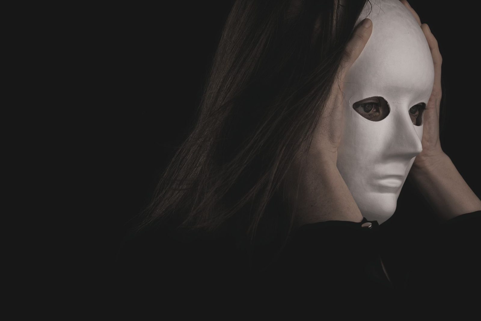 Person wearing a white mask