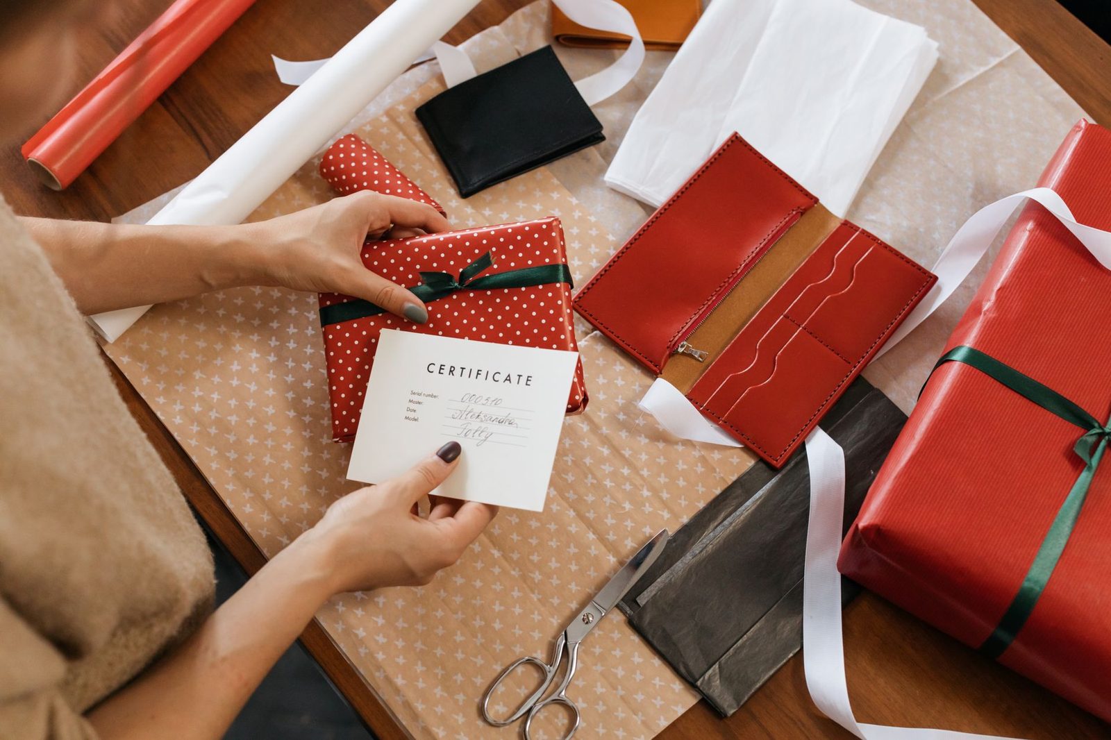 Wrapped gifts and a card on a table
